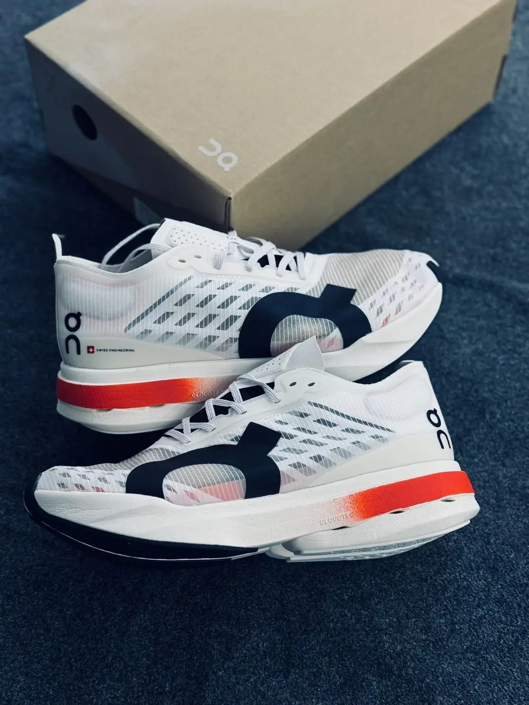 On Cloudboom Strike White Orange